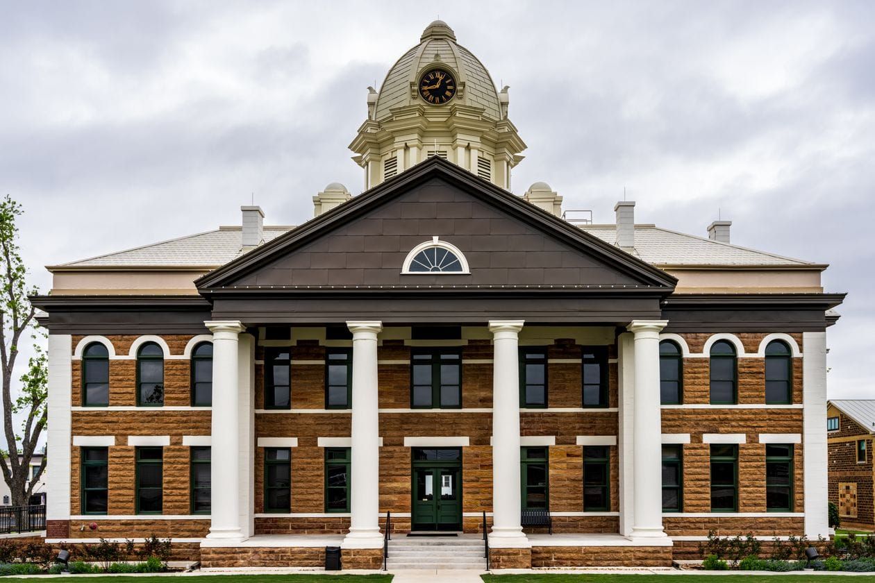 Photoreal brick home exterior under soft daylight, no people, logos, or text