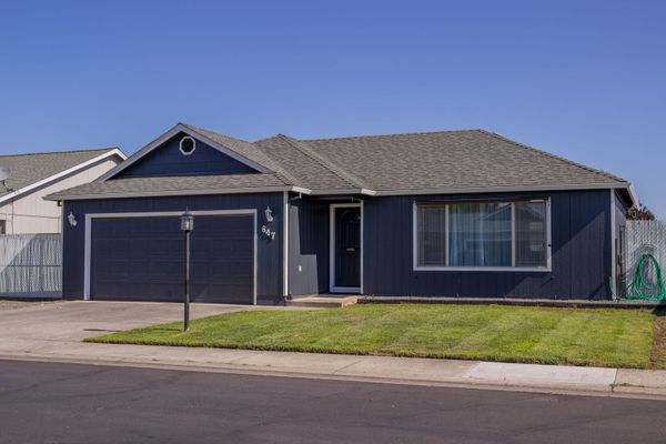Photoreal Johnson City hillside home under clear sky, no people, logos, or text