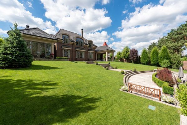 Photoreal 16:9 Brentwood Tennessee upscale residential street, no people logos or text