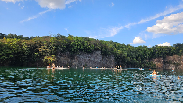 Swimmers and paddleboarders on Augusta Quarry at Fort Dickerson Park in Knoxville