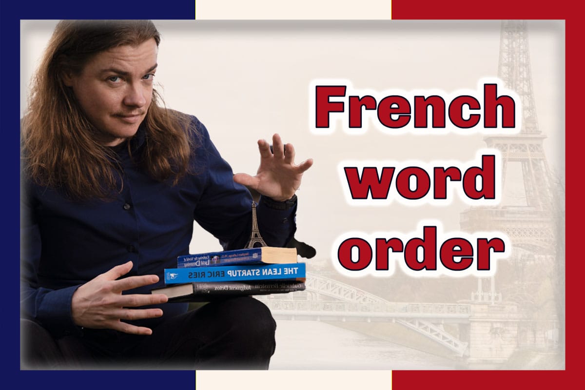 Angel Pretot sits looking at the camera with three books and a toy Eiffel Tower balanced on his lap.  The words French word order in red outlined in white at right