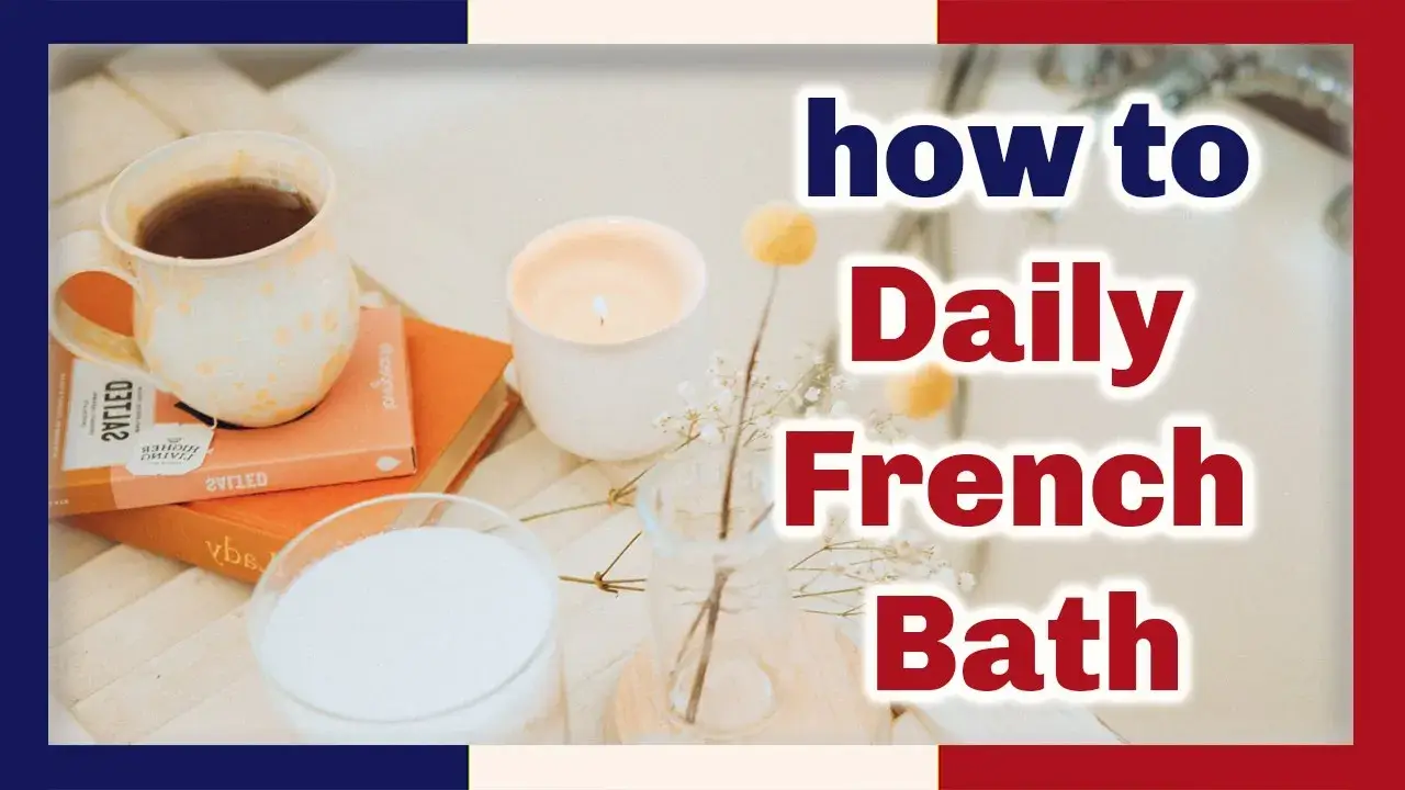 Two books and a cup of tea on a table with a candle and glass of milk, the words how to Daily French Bath at right in red and blue