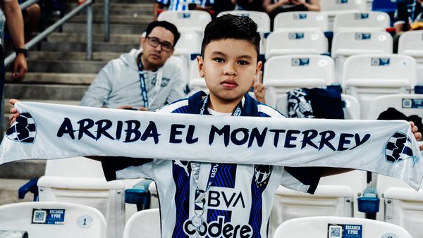 Rayados v Pachuca - Child holding up a Monterrey Scarf
