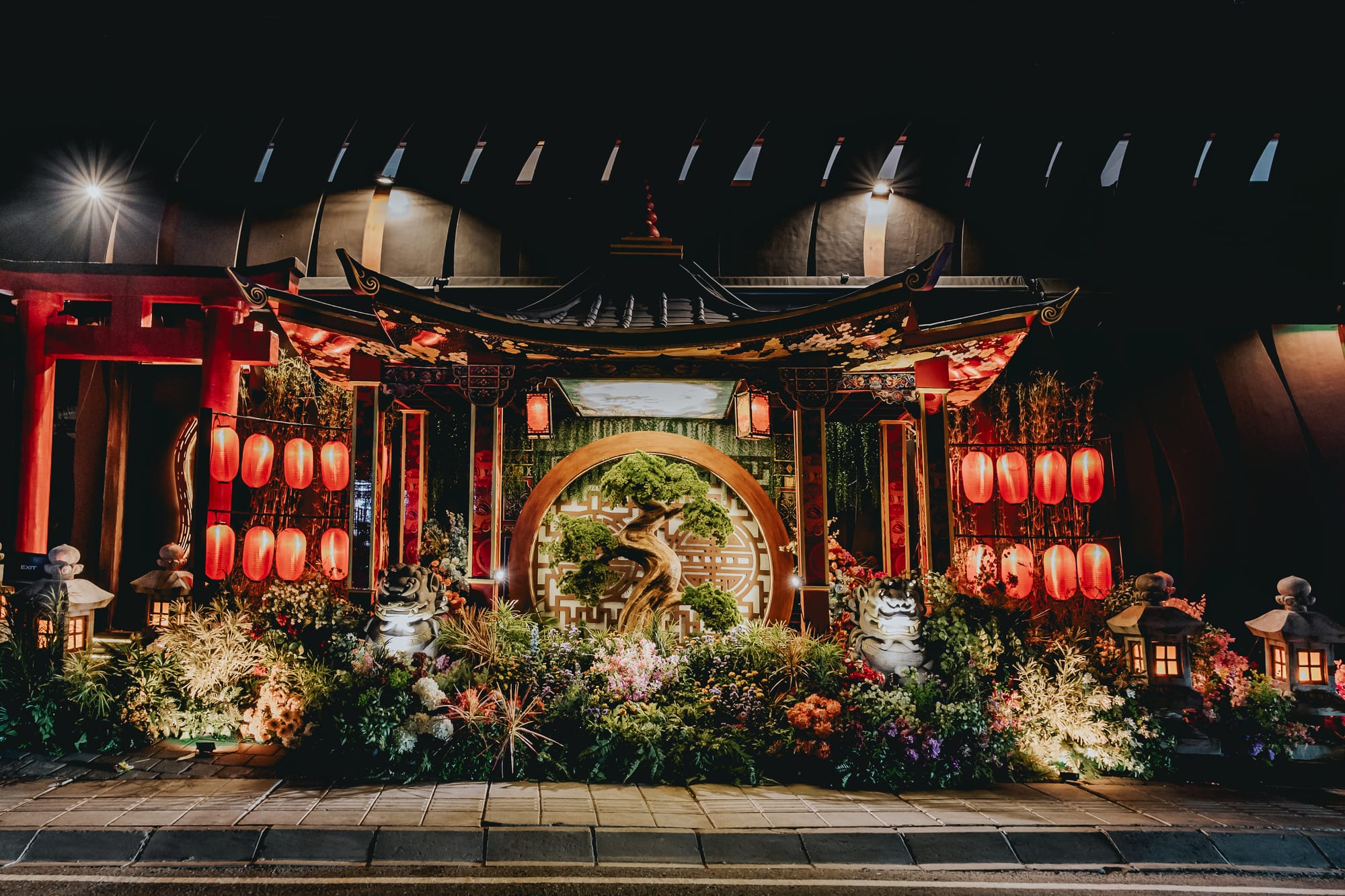 Miss Fish Canggu exterior transformed for MATSURI 2026 with Japanese lanterns, dark wood panels, and shrine-style signage at night