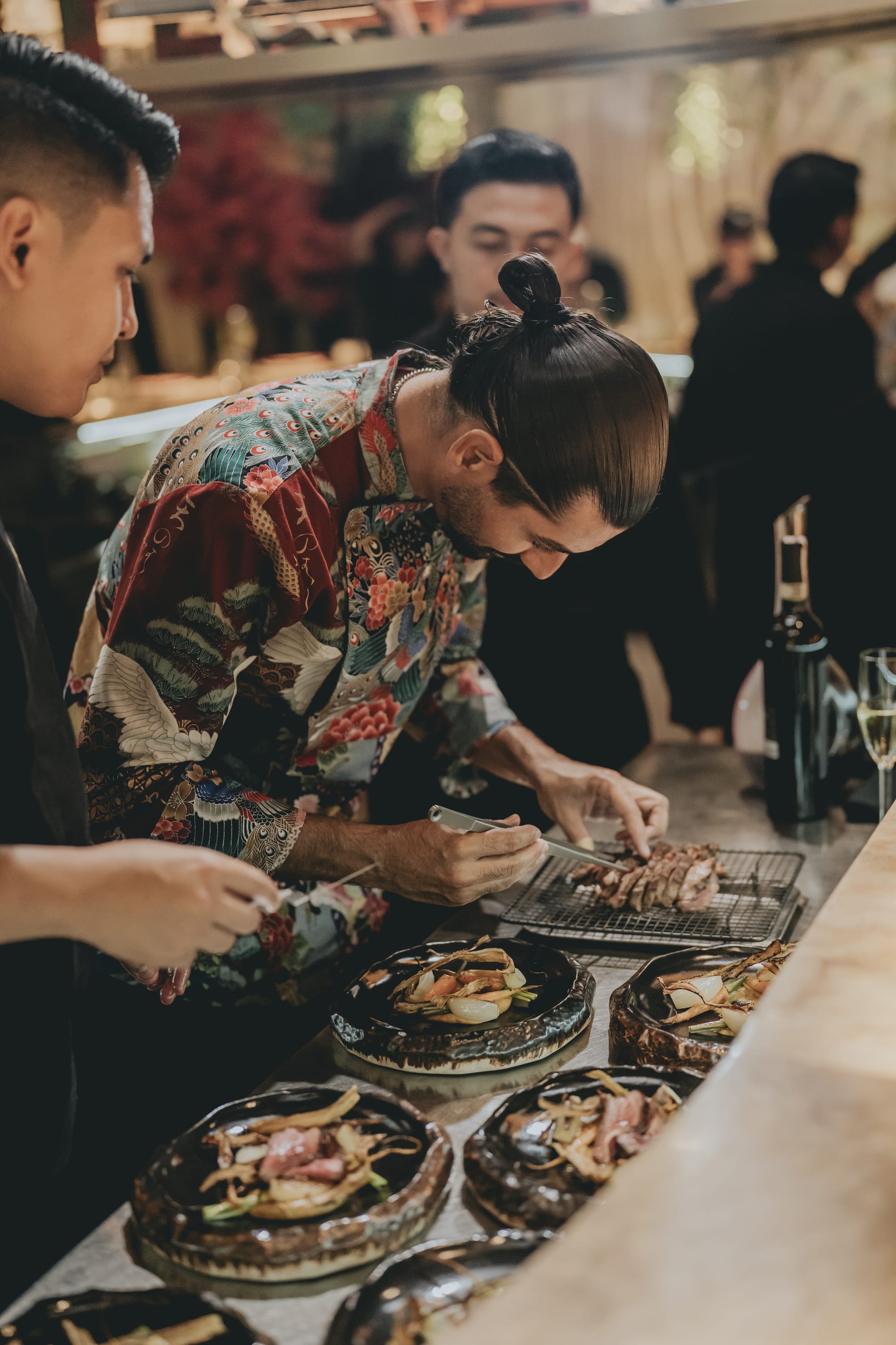 Chef Carlos Barvo and the Miss Fish kitchen team plating dishes at the MATSURI omakase counter in Canggu, Bali