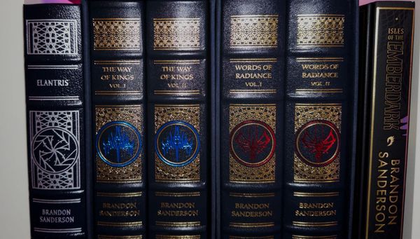 A shelf of Brandon Sanderson books.