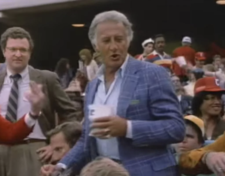 Image of Bob Uecker at a baseball game in a commercial for Miller Light where he famously said "I must be in the front row."