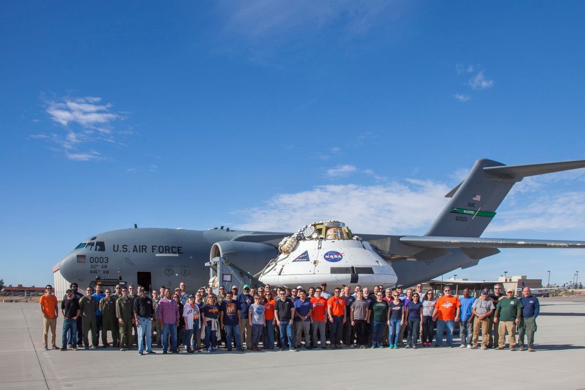 The Orion spacecraft Capsule Parachute Assembly System team pose for a photo in Yuma, Arizona. (U.S. Air Force photo by Christopher A. Okula)