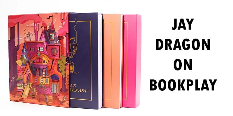 The Yazeba's box collection: A big pink cube with several books that demand attention.