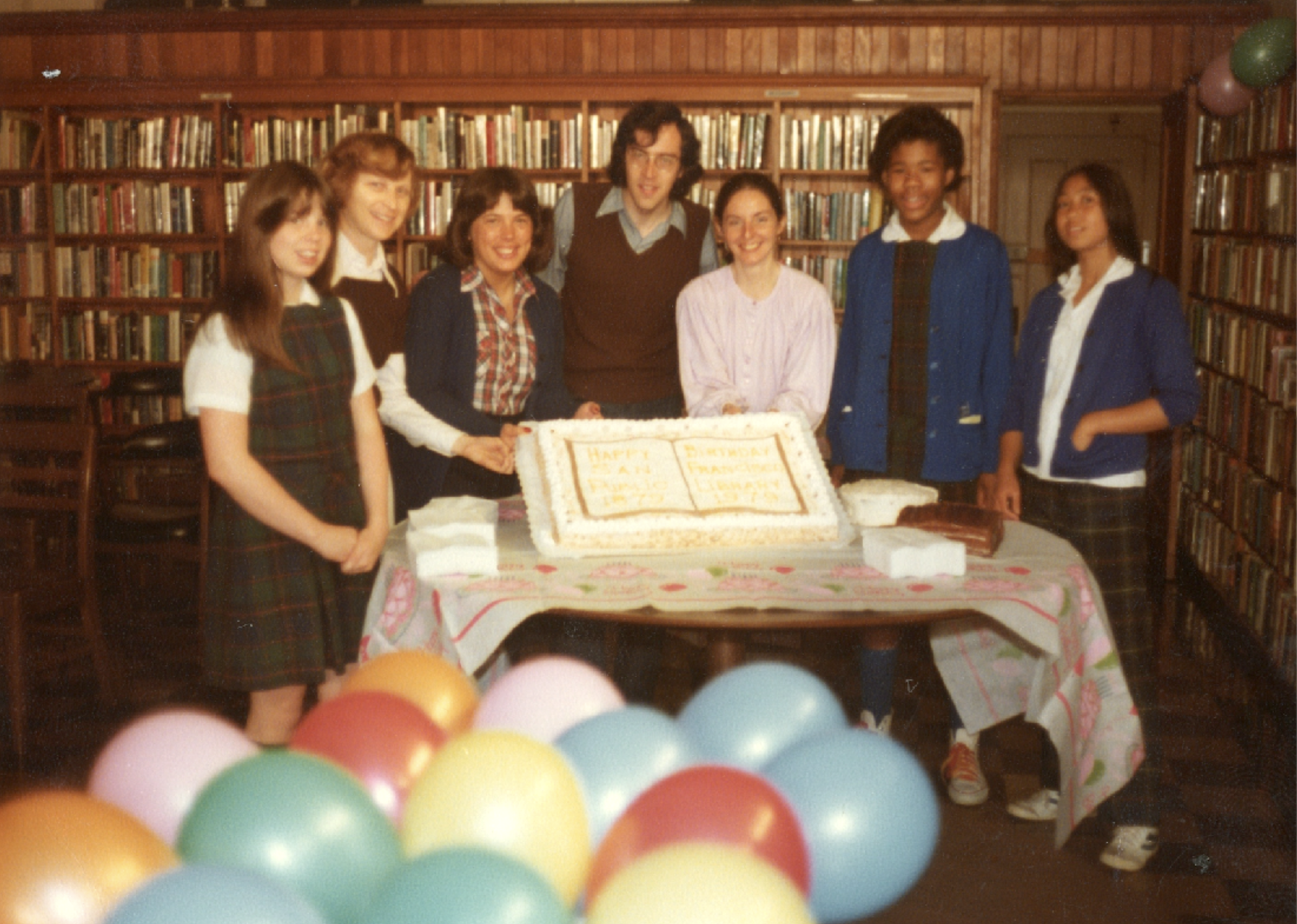 People around a cake.