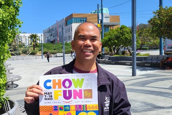 Man with poster.