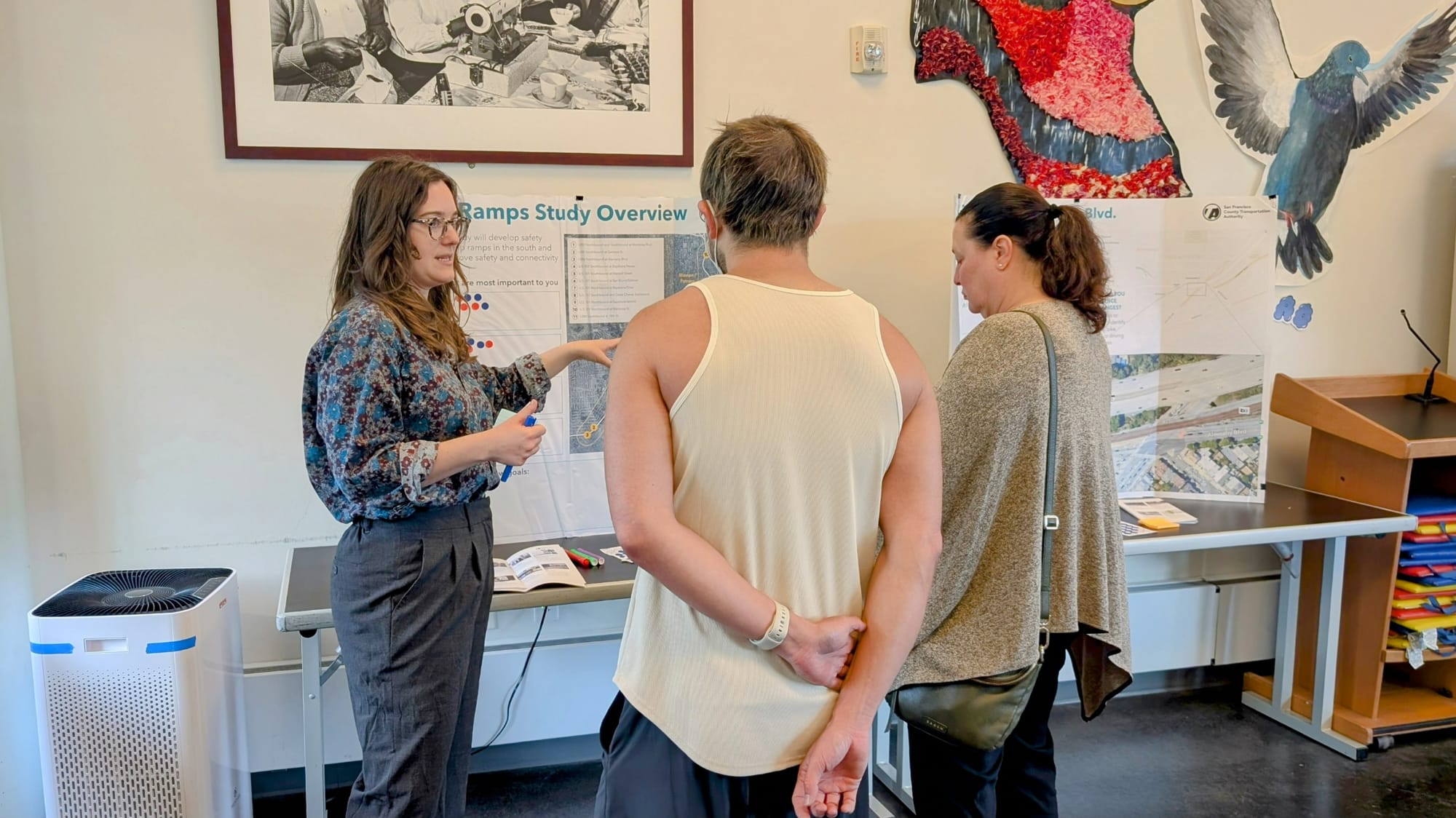 People at a table with chart.