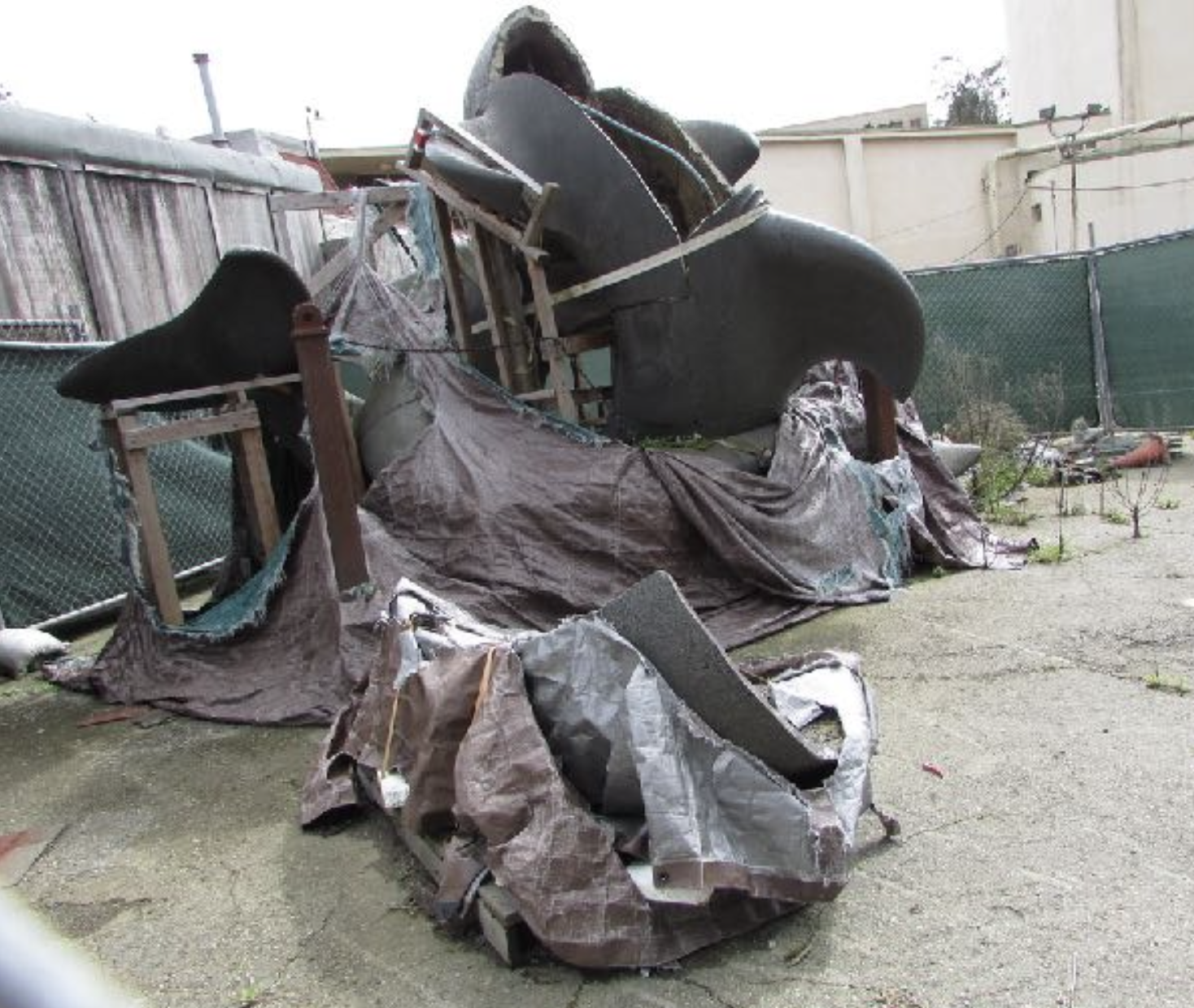Whale statue in disrepair.