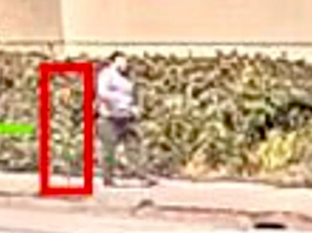 Grainy photo of a man.