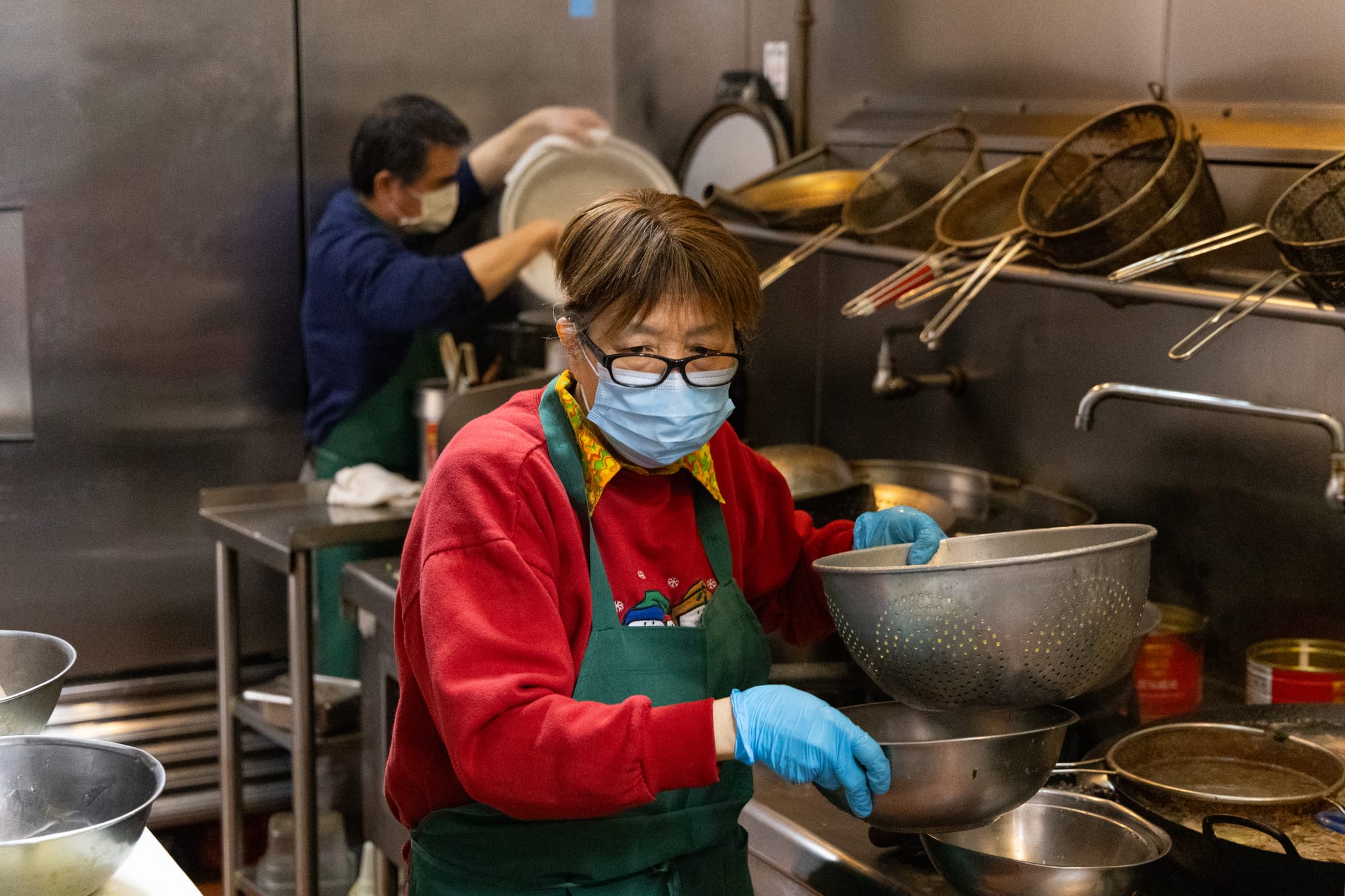 Woman prepares kitchen.