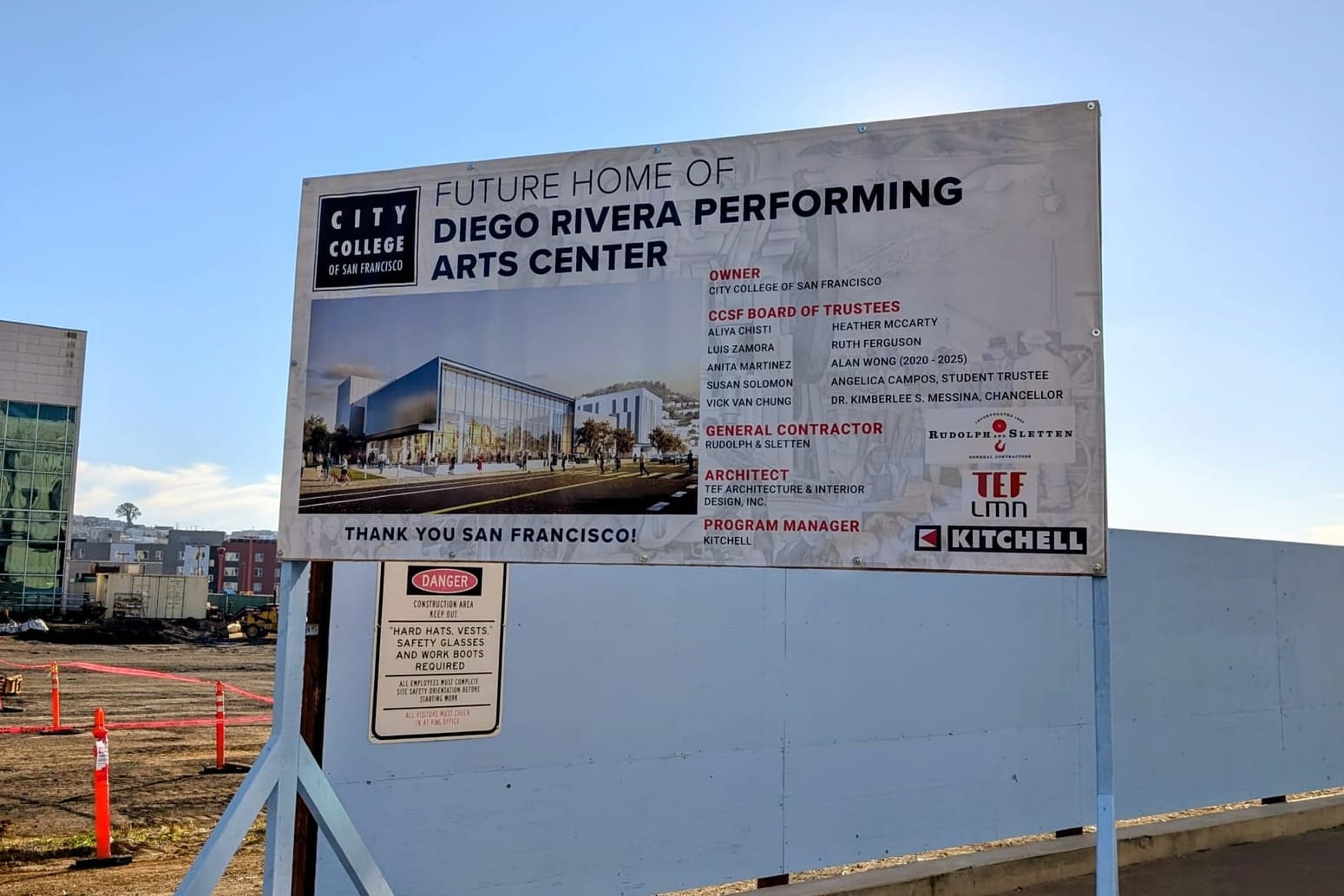 A sign about the performing arts center construction.