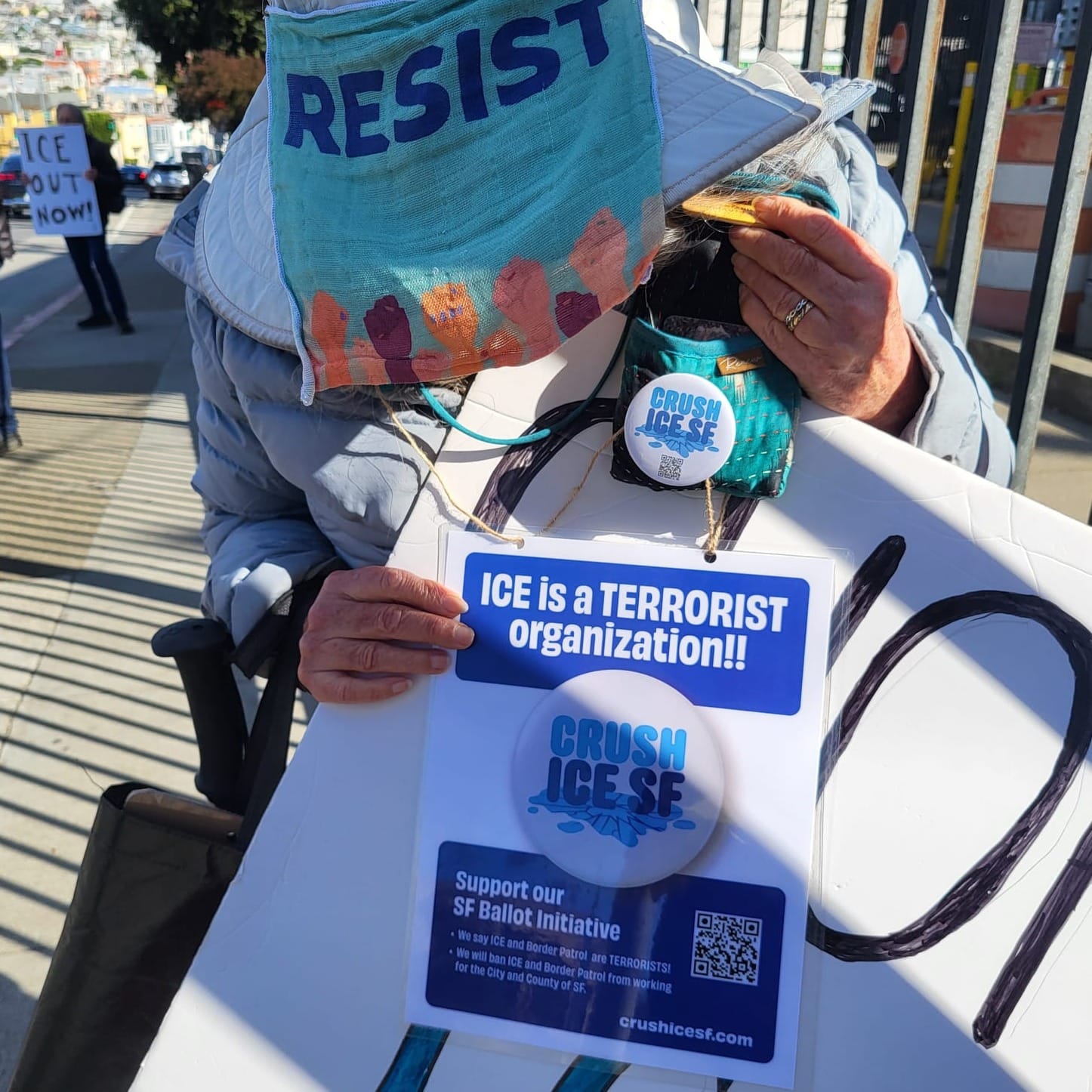 Woman showing a sign.