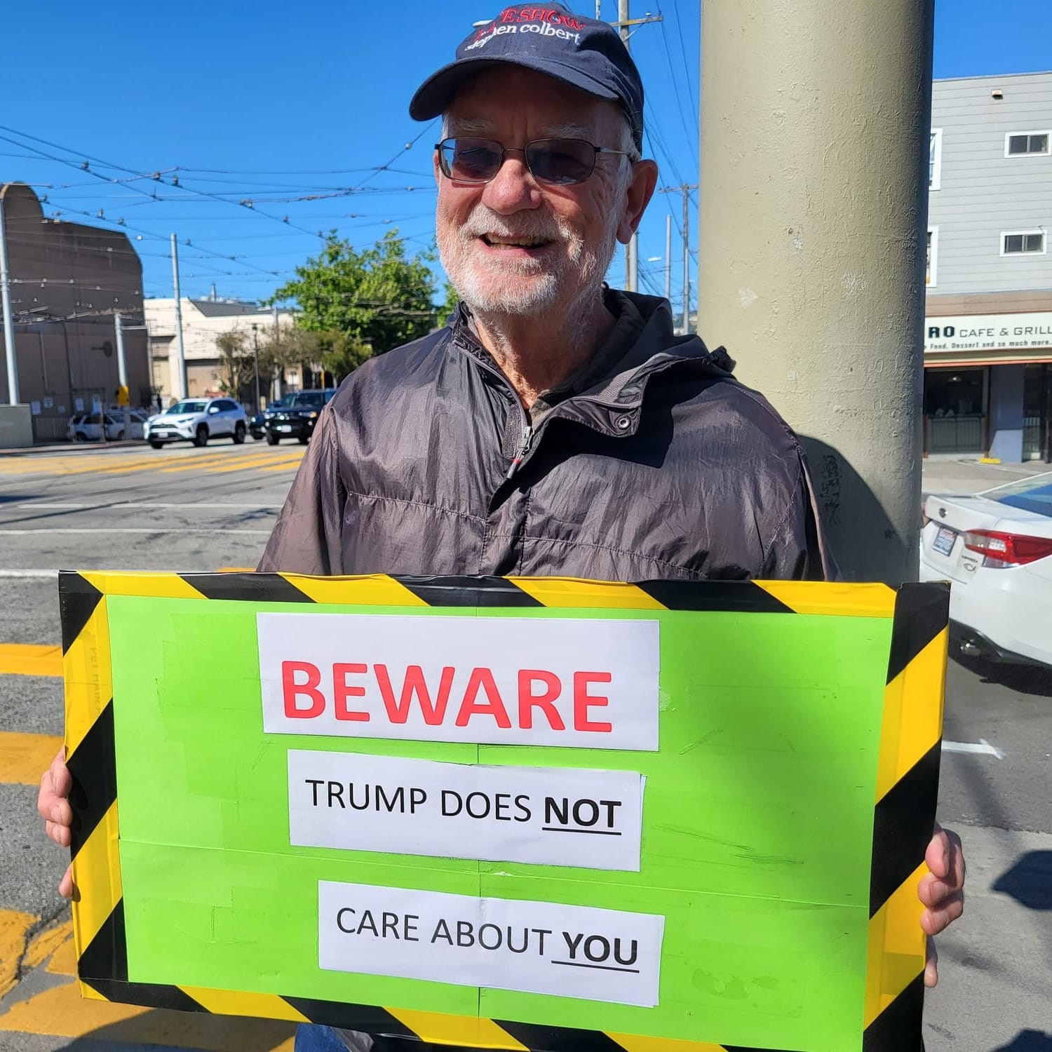 Man holding a protest sign.