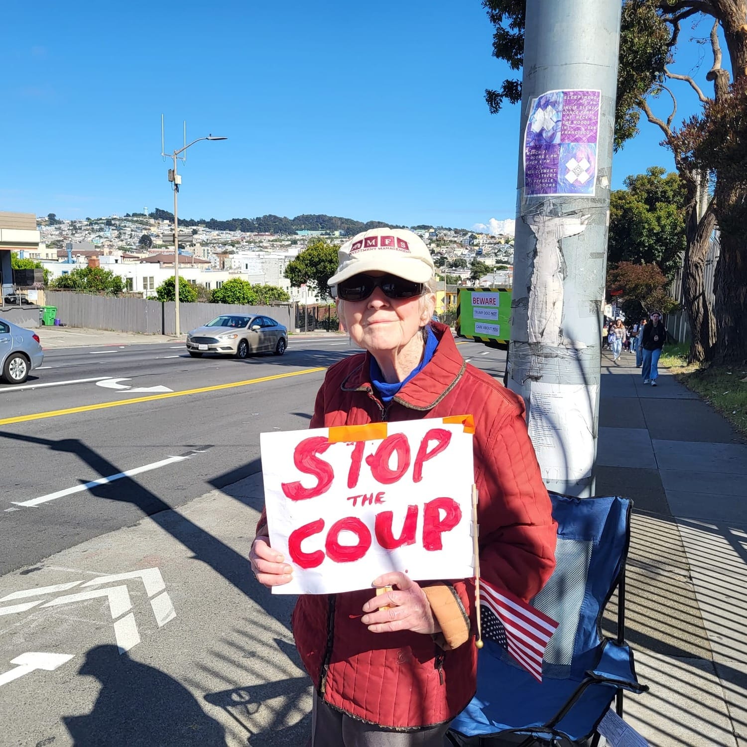 A woman holding a sign.