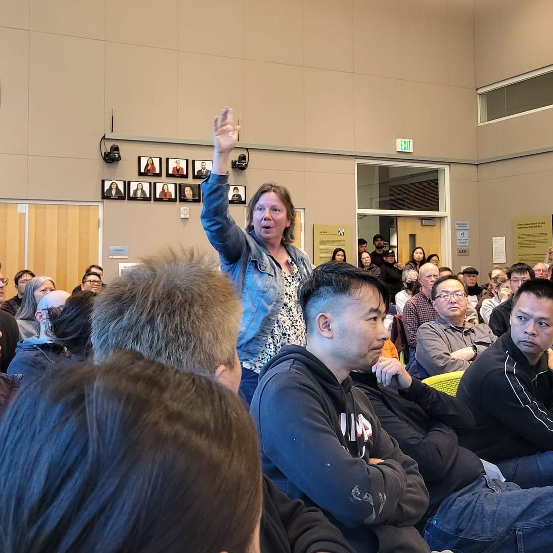 Woman speaking at a meeting.