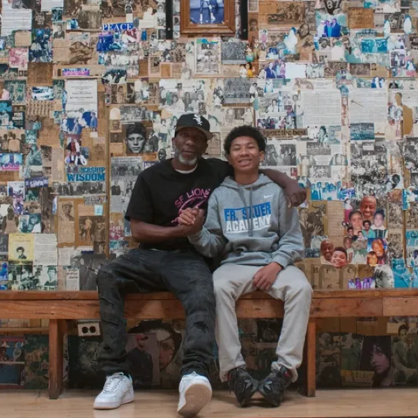Father and son on bench in church with collage.