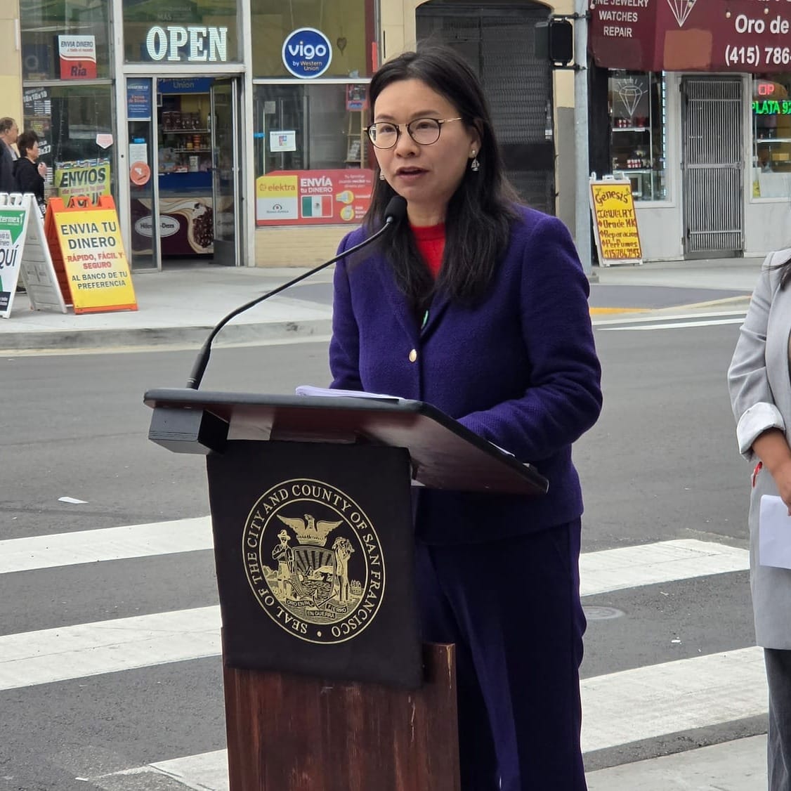 A woman at a podium.