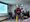 Man in front of a screen talks.