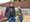 Two people posing at a garden.