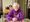 Woman seated at table.