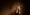 A singular woman with a shocked expression and hands near her face with a sepia filter over the image.