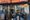A woman in front of a hardware shop.