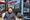 Man standing in front of a grocery store.