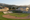 A rendering of two police stations beside a baseball field.