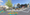 A rendering of a color residential intersection with lots of people and plants.