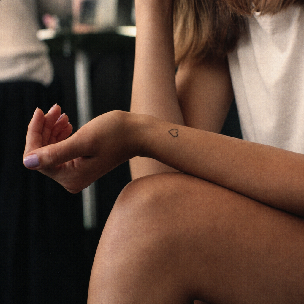 A conventional fine-line tattoo — the same result a Microdot patch promises to reach without a needle.