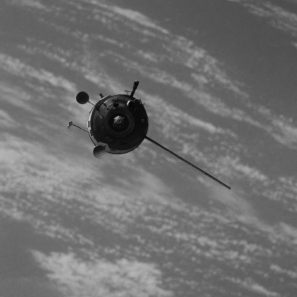 An orbiting satellite with Earth in the background.