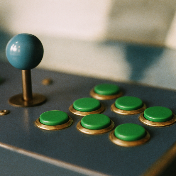 a close up of video game arcade controls with green buttons
