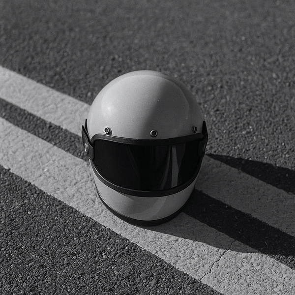 white helmet on grey concrete pavement