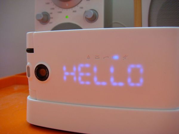 An old mobile phone with the word 'Hello' on the case