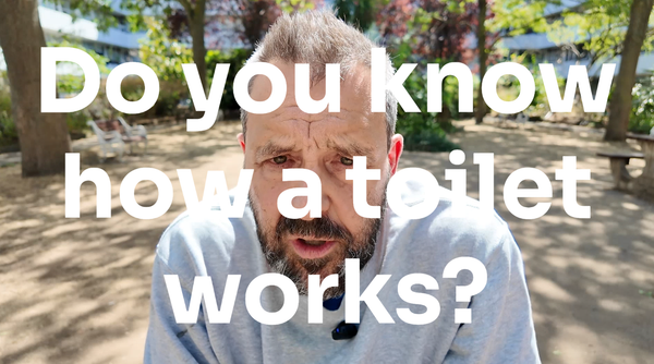 A picture of a bearded man (the author) with the words Do you know how a toilet works superimposed