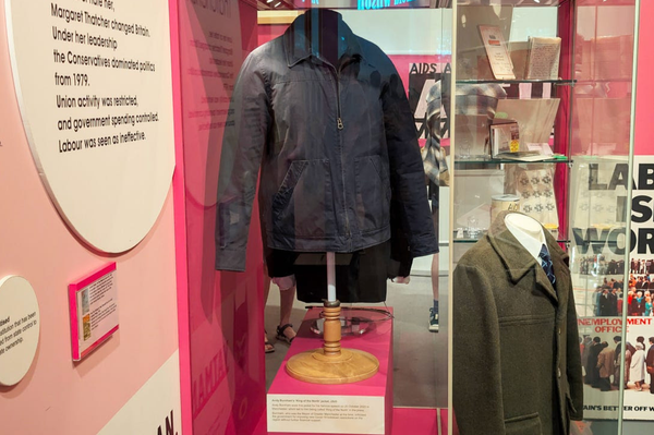 “dark navy workers’ jacket” in a museum display