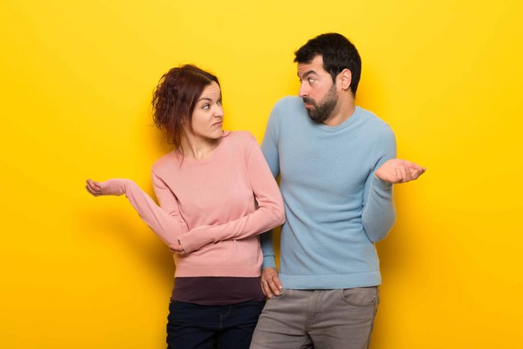 A dating couple looks at each other with incredulity on how they should date.