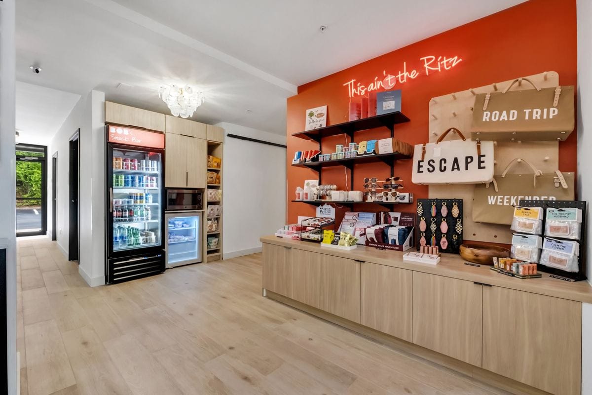 BOB's provisions shop with snacks, drinks, a cooler and tote bags