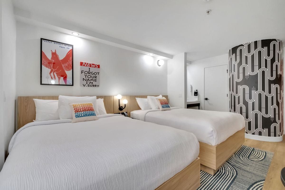 Two queen beds with Tallahassee pillows in a BOB Hotels Double Queen room