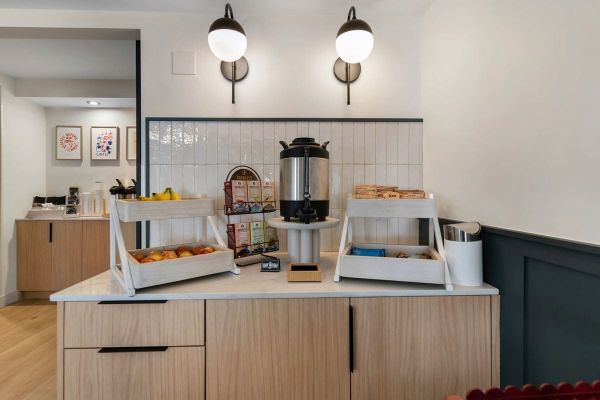 BOB's breakfast bar with a coffee urn, fresh fruit and pastries