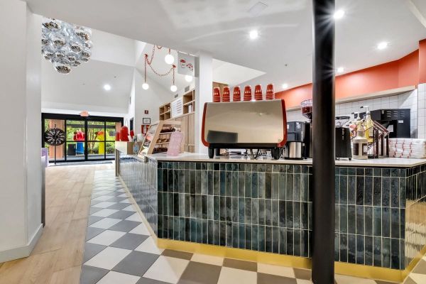 The Café at BOB: a tiled counter with an espresso machine on a checkerboard floor