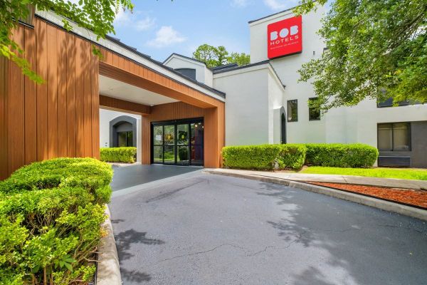 The BOB Hotels entrance with its wood-clad porch and red logo
