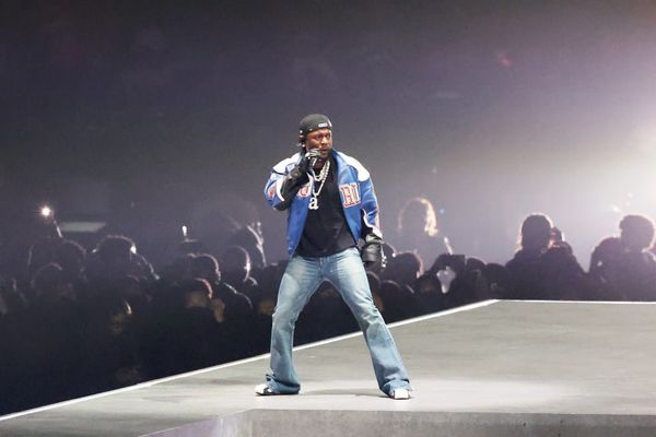 An image of Kendrick Lamar on stage during his Super Bowl Halftime Performance