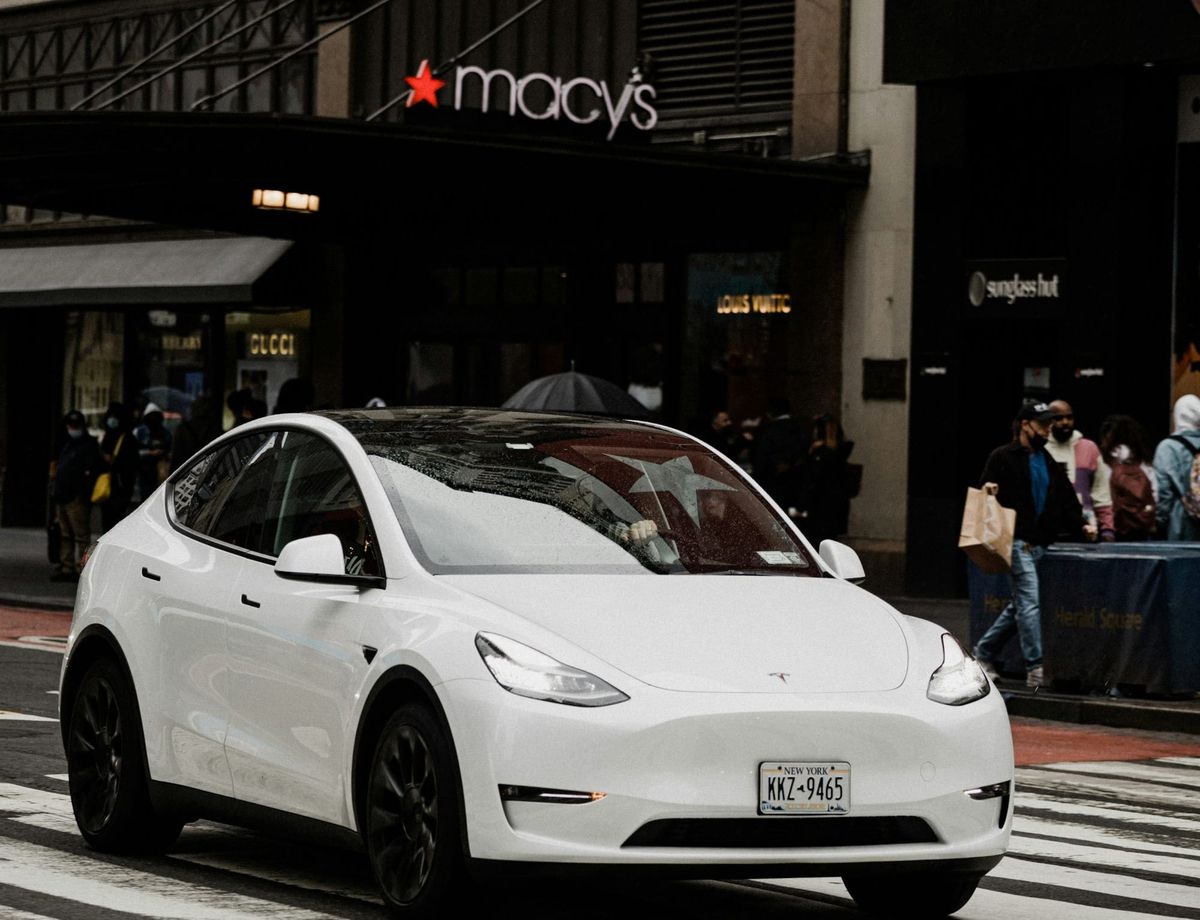 Tesla driving past Macy's New York City