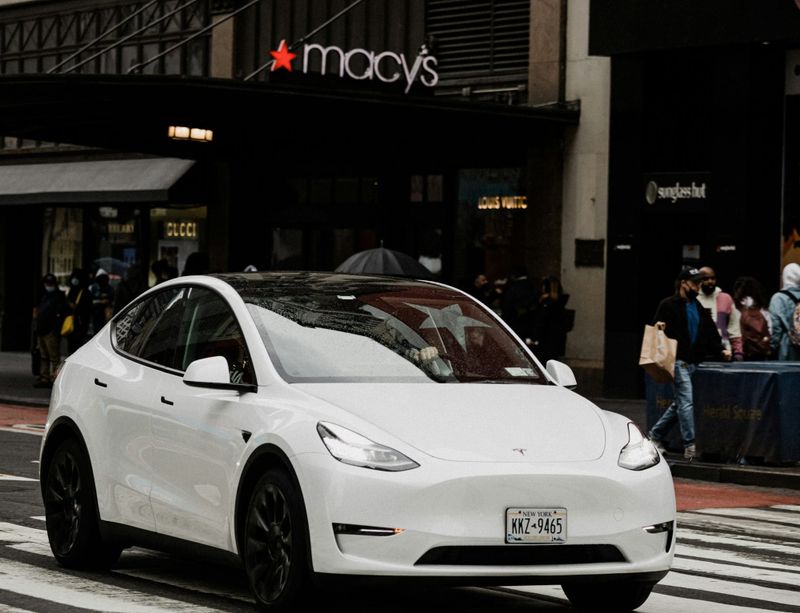 Tesla driving past Macy's New York City